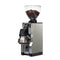 Introducing the Eureka Mignon Libra 65 All Purpose Grinder in chrome, a sleek espresso grinder designed with silent technology and flat burrs. It features a digital display and a clear hopper filled with coffee beans, complemented by a black base and transparent container for ground coffee.