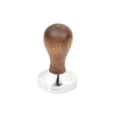 The HCS Walnut Tamper (58mm), an essential espresso machine accessory from the brand HCS, is centered against a white background. It features a shiny stainless steel base and a rounded, smooth wooden handle that provides a comfortable grip for pressing coffee grounds. Its 58 mm diameter ensures precise brewing.