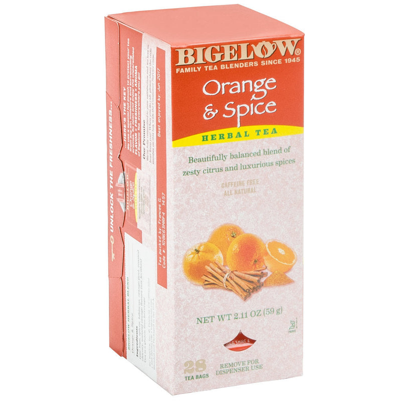 A box of Bigelow Orange and Spice Herbal Tea Bags showcases a vibrant red and orange design. The front features an image of oranges and cinnamon sticks, highlighting that it contains 28 tea bags, is caffeine-free, all-natural, and weighs 2.1 oz (59 g). Enjoy a premium tea experience crafted by the Bigelow family.