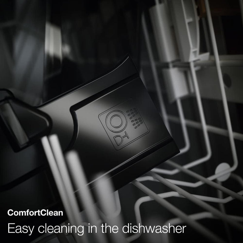 A close-up of a black plastic container labeled "ComfortClean" placed inside a dishwasher. Visible are the rack and other parts of the dishwasher. The text "Easy cleaning in the dishwasher" is displayed at the bottom, perfect for your Miele CM6160 Milk Perfection Countertop Coffee Machine's one-touch programming needs.