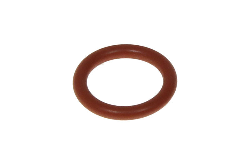 A small, circular DeLonghi O-ring (5332177500) in orange-brown, placed against a plain white background. The unblemished and smooth O-ring indicates suitability for Primadonna sealing applications.