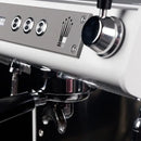 Close-up of a sleek black espresso machine, the Conti ACE, focusing on the portafilter and control panel with three buttons. This multi boiler marvel boasts a modern finish and elegant design for ultimate coffee precision.