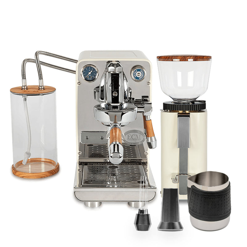 The ECM Puristika setup, an ECM brand cream semi-automatic espresso machine, includes the C-Manuale 54 Burr Grinder and accessories. Featuring wood accents and an E61 group head, this stylish bundle has a transparent water tank and milk frothing pitcher for a modern coffee station.