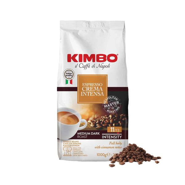 A bulk value pack of Kimbo Crema Intensa Whole Coffee Beans (6 x 1kg / 2.2lb), featuring white packaging with red and brown accents, adorned with a coffee cup image, beans, and details. This medium dark roast with an intensity of 11 out of 13 provides cinnamon flavor notes, making it ideal for espresso-based drinks.