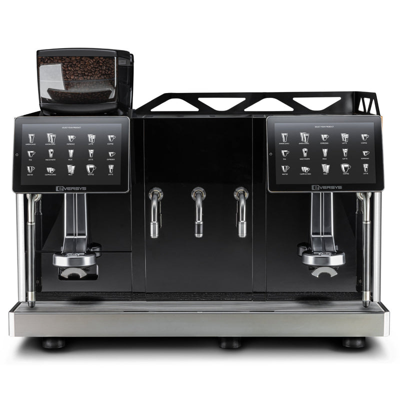 The Eversys Enigma E'4s x-wide/Classic (Tempest) commercial espresso machine by Eversys features dual touchscreens, two group heads, and three steaming wands to enhance barista productivity. Its sleek black and stainless steel design includes a visible bean hopper on the left, with multiple drink options selectable from the screens for seamless dual operation.