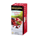 A box of Bigelow Cranberry Apple Tea Bags, which is caffeine-free and all natural, features images of cranberries and an apple, along with branding and details about the tea. The red box contains 28 tea bags with a net weight of 1.7 oz (48g).