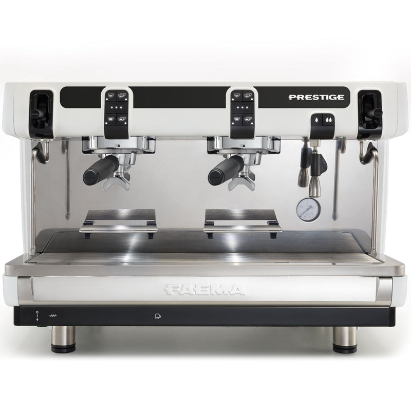 The FAEMA Prestige Compact 2 Group Head Tall Cup Autosteam 208V Espresso Machine F01-UR210Z9BFDDGA (White) is a sleek, professional-grade espresso machine with dual spouts for brewing two espressos simultaneously. Featuring a Smartboiler, digital display, pressure gauge, and Autosteam wand, it bears the "Faema PRESTIGE" label on the front and boasts a stunning stainless steel finish.