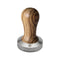 Displayed against a white background is the Lelit 58.55mm Stainless Steel and Zebra Wooden Handle Tamper PLA481Z. The ergonomic zebra wooden handle's natural grain adds a touch of elegance, while a small logo on the edge of the metal base enhances its sophisticated design. Ideal for use with Lelit filterholders, this tamper is both stylish and functional.