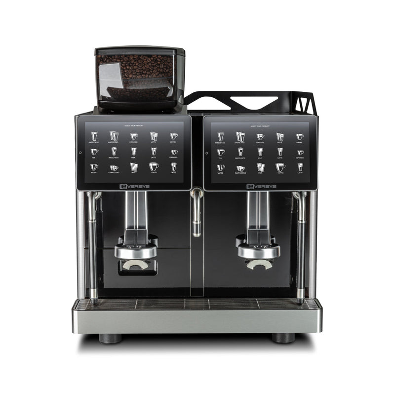 The Eversys Enigma 2 Group Head Steam Wand Classic Espresso Machine E'4s/Classic (Tempest) is a large, black commercial unit with numerous buttons for different drink options. It features two dispensing nozzles and a small transparent compartment at the top containing coffee beans. Its front panels display icons of various coffee beverages, making it ideal for efficient espresso production.