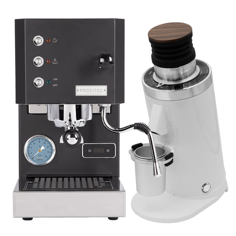 The Profitec Go (Black) Espresso Machine, featuring a sleek design with silver accents, is perfectly matched with the DF64 Gen 2 Grinder w/ DLC Burrs in White. The grinder combines modern and classic styles with its white finish and wooden top. This single boiler espresso machine is equipped with multiple buttons, a portafilter, and a pressure gauge.