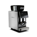 A sleek, modern espresso machine with a digital touchscreen interface. The fully automatic Eversys Shotmaster 2 Group Head Coffee Compact Classic Espresso Machine c/Classic (Tempest) features a stainless steel body, a large black bean hopper on top, and dual spouts for dispensing coffee below—ideal for high volume environments.