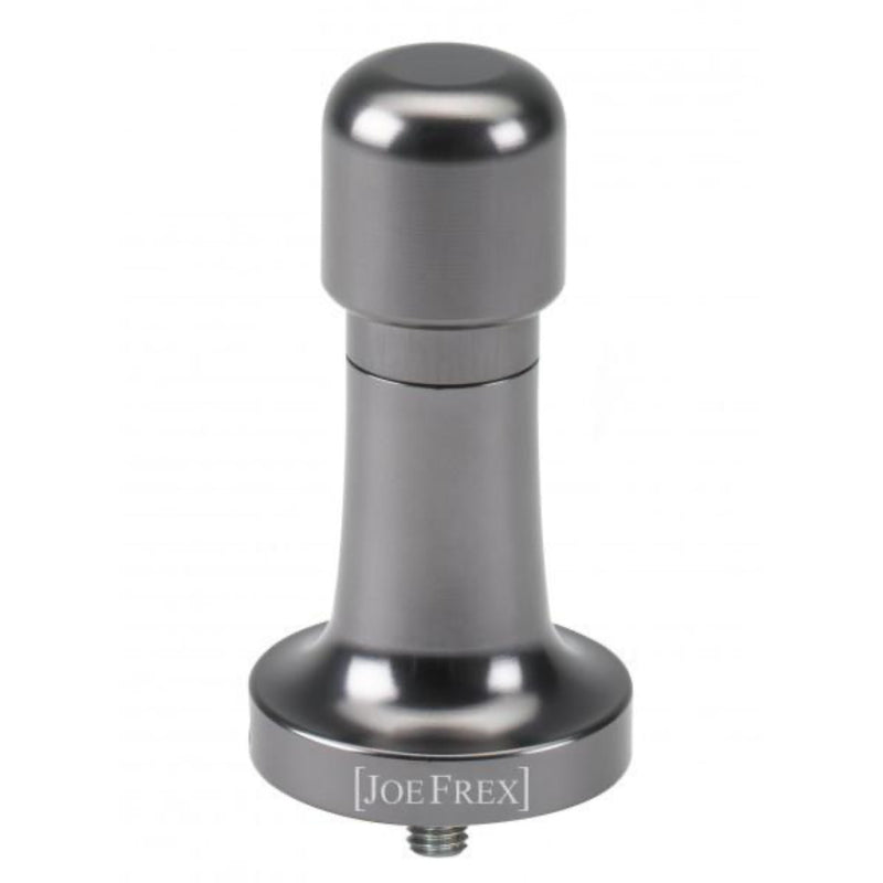 The JoeFrex Technic Calibrated Dynamometric Adjustable Tamper Handle in gunmetal, is displayed. This tamper, featuring JoeFrex's signature grip technology, has a sleek cylindrical handle and a flat base. Predominantly silver in hue, it is elegantly engraved with the brand name "JoeFrex" at the base.