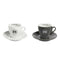 The Rocket Espresso Cups Hashtag Series - Set of 6 RA99907206 (White) includes two ceramic espresso cups with saucers, each adorned with the letter "R" inside a circle. One set is white and the other is black. These Rocket Espresso cups feature small handles, with the branding "