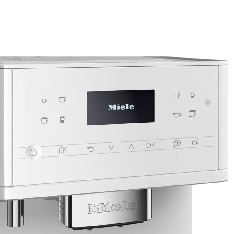 A Miele CM6160 Milk Perfection Countertop Coffee Machine (Lotus White) features a digital display screen that reads "Miele." Various buttons and icons for different coffee options, including the OneTouch for Two feature, are positioned beneath the screen. It also includes an on/off button and other control icons. The machine showcases a minimalistic design.