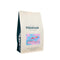 A 12oz bag of Equator Coffee Roasters J.O.M.O. Coffee Bean stands upright with abstract artwork on a purple label. It offers fruit notes for espresso enthusiasts, featuring medium-dark roast whole beans in a light beige packaging, contrasting with its dark base.
.