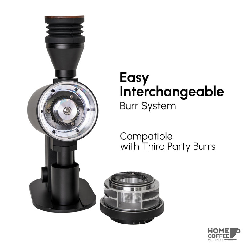 The DF Grinders DF83V coffee grinder in black features a sleek cylindrical design and an easy interchangeable burr system compatible with third-party and DLC burrs, ensuring versatility.