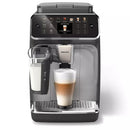 A sleek, modern Philips 4400 LatteGo Super Automatic Espresso, Cappuccino, & Latte Macchiato Machine with SilentBrew EP4447/90 and a digital touch interface displays various hot & iced coffee recipes. A latte macchiato is being prepared, with a glass under the spout and a built-in milk frother beside it. The machine features SilentBrew technology and a stainless steel drip tray.