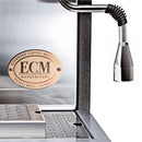 Close-up of the ECM Synchronika Espresso Machine - Dual Boiler w/ PID (Heritage Edition) with a plaque reading "ECM Manufacture Heidelberg Germany." The image highlights the steam wand and drip tray, emphasizing its dual boiler design and fast heat up for quick, perfect brews.