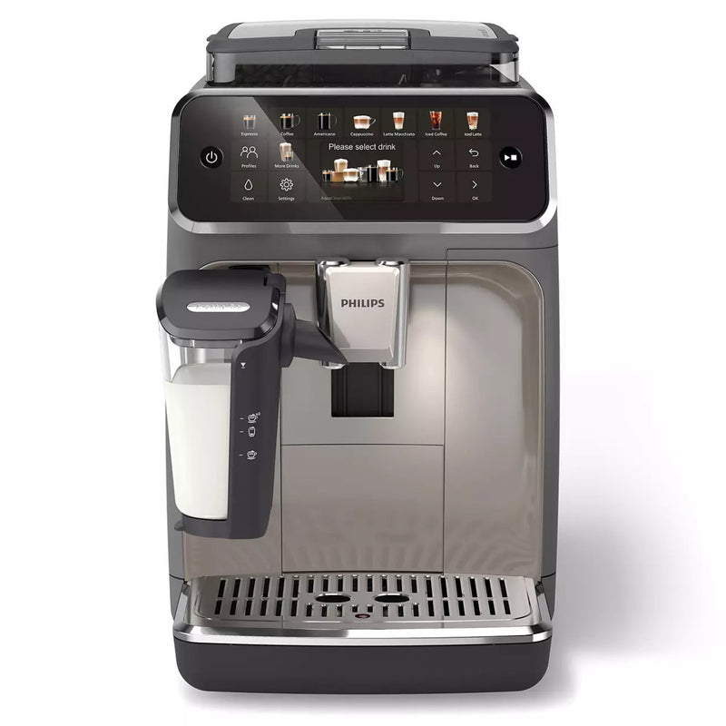 The Philips 5500 LatteGo Super Automatic Espresso, Cappuccino, & Latte Machine with SilentBrew EP5544/90 features a modern digital touch screen displaying various drink options. It is equipped with SilentBrew technology and includes a milk frother attachment on the side. The machine boasts a stainless steel casing and a drip tray in the base for easy maintenance.