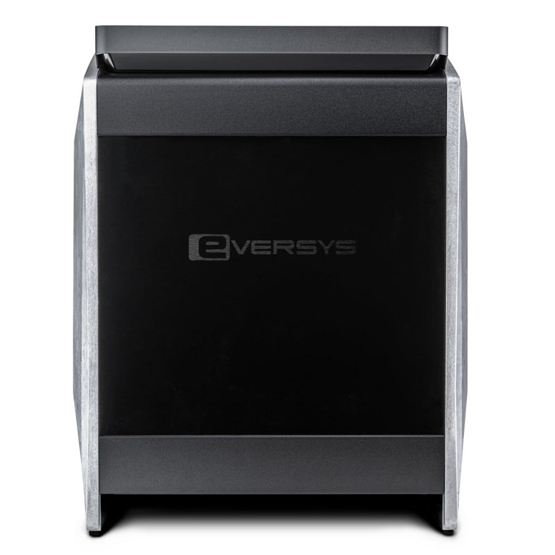 Front view of the Eversys Cameo Coffee & Tea Super Traditional Espresso Machine C'2c/ST (Raw) in black. The machine boasts a sleek, modern design with a rectangular shape, featuring a flat top and slightly tapered sides. Integrated into the unit are both a coffee grinder and steam wand. The "Eversys" brand logo is prominently displayed in the center of the front panel.