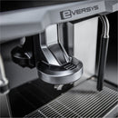 Close-up view of the Eversys Cameo Steam Wand Classic Espresso Machine C'2s (Tempest) highlighting the portafilter holder and drip tray. The sleek black and stainless-steel design, complemented by a powerful steam boiler, emphasizes its modern and industrial style, perfect for creating Latte Art.