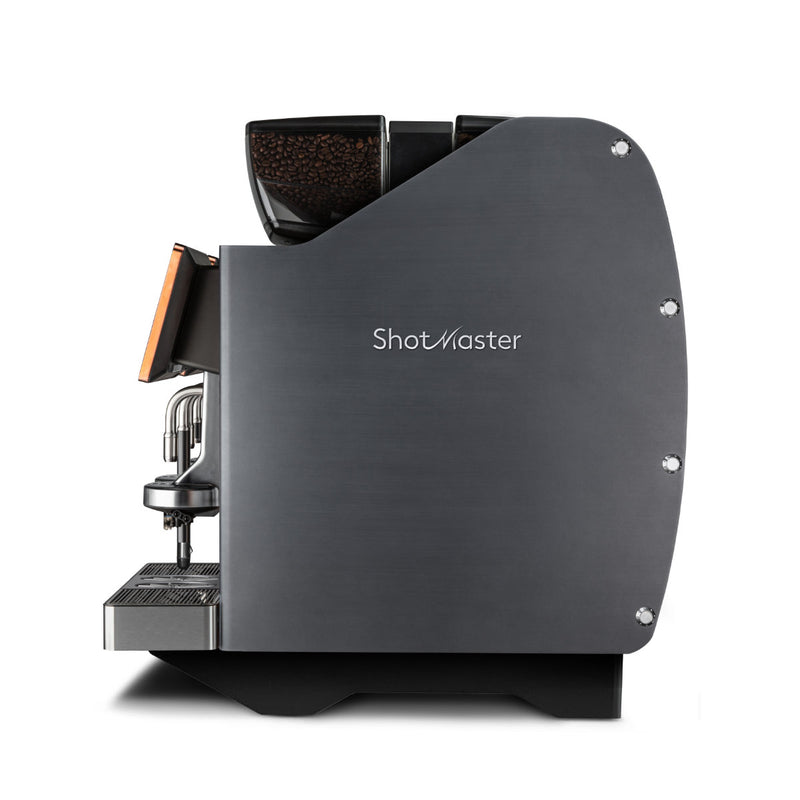 A side view of a sleek, modern coffee machine labeled "Eversys Shotmaster 4 Group Head Milk System Pro Super Traditional Espresso Machine ms-pro/ST (Charcoal)." It features a matte black finish with chrome accents, a transparent coffee bean hopper on top, and includes a built-in milk module, steam wand with Everfoam technology, drip tray, and dual spouts for dispensing coffee underneath.