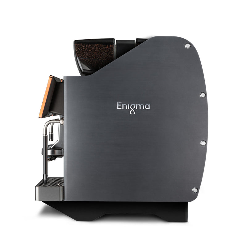 Side view of a modern, charcoal espresso machine with a sleek design. The word "Enigma" is displayed on the side in white letters. The Eversys Enigma 2 Group Head Milk System Super Traditional Espresso Machine E'4ms/ST features a bean hopper at the top, a spout, and a drip tray at the bottom, capable of producing 350 espressos per hour with Electronic Milk Texturing functionality.