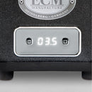 Close-up of a digital display on the ECM S-Automatik 64 Burr Grinder (Anthracite), featuring the number "03.5" with plus and minus buttons on each side. Above, a round label reads "ECM Manufacture Heidelberg - Germany," ensuring precise coffee doses and freshly ground coffee every time.