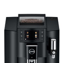 The Jura E8 Piano Black Automatic Coffee Machine 15648 (Latest Version) is a stylish and modern appliance, boasting a sleek black finish and a digital display screen that showcases various coffee beverage options. The top compartment, clearly visible, is filled with coffee beans. This machine from Jura features advanced brewing technology, complete with a spout for dispensing coffee and an integrated frothing unit on the side.