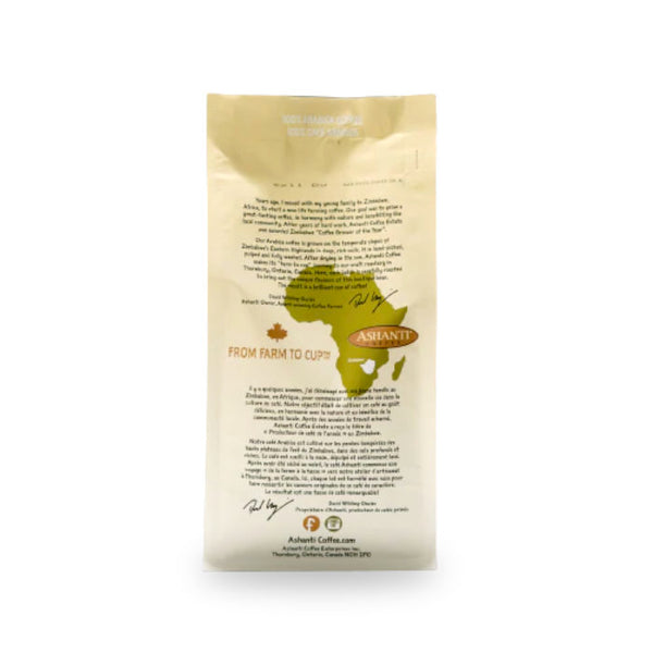 The Ashanti Artisan Coffee African Medium Roast Ground Coffee 6 pk Bulk Value Pack comes in a beige bag adorned with text and a green illustration of Africa. The packaging provides details on the origins and process of the medium roast coffee. A brown ribbon features "ASHANTI" as the logo, while contact information and a website address are listed at the bottom of the bag.