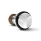 A sleek earbud with a metallic finish and geometric design, resembling latte art foam in comfort. It features silver, black, and brown hues.