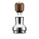 The Breville the Distribution Duo™ 54mm BEA203WLW is a sleek, modern coffee distributor and tamper featuring a stainless steel base and wooden handle. Ideal for precise Latte Art, this adjustable device displays "54 mm" on the base.