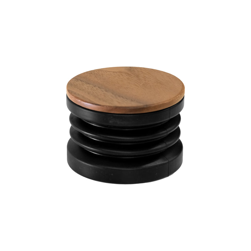 The DF83V by DF Grinders is a black, round, collapsible coffee grinder with an accordion-style design and a flat wooden lid. This versatile appliance features variable speed control and DLC brew burrs for precise grinding.