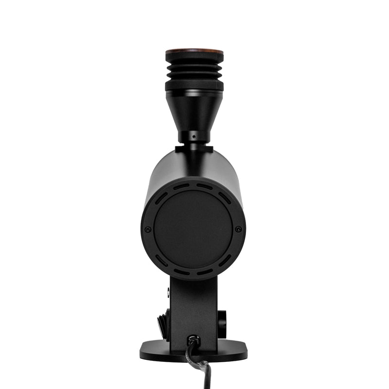 Against a white background sits the DF83V Variable Speed Single Dose Coffee Grinder by DF Grinders, featuring an elegant minimalist design in black. It has a cylindrical shape with a long spout and rounded base, 83mm DLC brew burrs, and a power cord extending from the base.