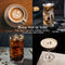 Four images of coffee drinks crafted with the DeLonghi La Specialista Maestro Espresso Machine with Cold Brew EC9885M (Silver): a latte featuring a heart design, an iced coffee with milk swirls, a cold brew with ice, and an espresso martini. Text reads: "Brew Hot or Iced - Perfect for your favorite coffee drinks, cocktails, and more.