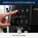 A person interacts with the touchscreen on a DeLonghi Magnifica Start Super Automatic Espresso Machine ECAM22022B (Black), choosing an espresso. The display presents a selection of coffee drinks, featuring LatteCrema Hot options. At the top, it reads "Simple & Intuitive Display," while the bottom states "One-Touch Recipes for a customizable experience.