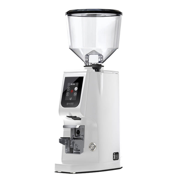 The Eureka Atom Excellence 65 Grinder in white, crafted by Eureka, is a sleek coffee grinder that includes a transparent bean hopper and a modern digital control panel. With its precise performance, it also features a chic black base that complements any kitchen setting.