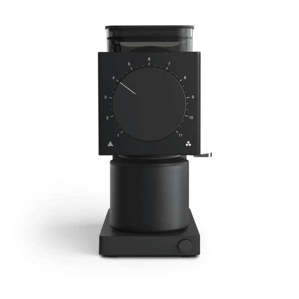 The Fellow Ode Coffee Grinder Gen 2.0 by Fellow is a sleek, modern home coffee grinder with a matte black finish that features precision grind quality and a large circular dial for selecting between 31 grind settings. The compact, rectangular base includes a small button on the lower right corner.