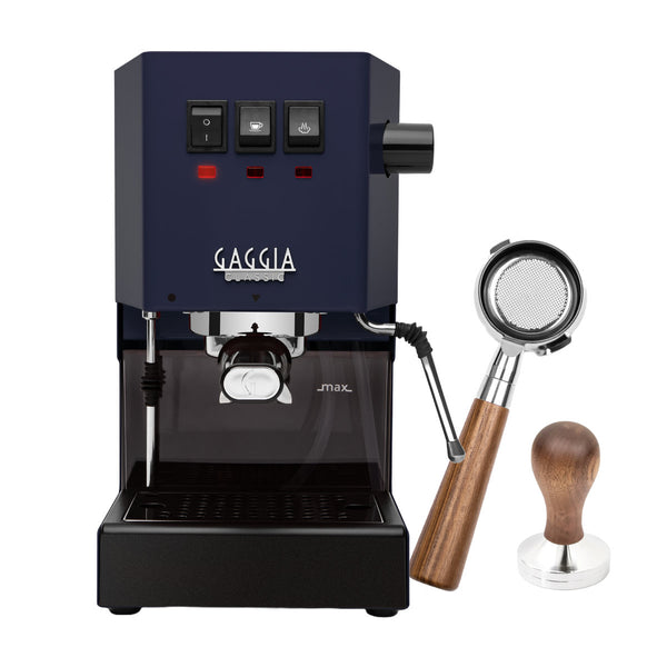 The Gaggia Classic E24 Espresso Machine in Classic Blue features three top-front buttons. To the right, a 58mm walnut tamper and bottomless portafilter with wooden handle are elegantly displayed, perfect for crafting the ideal espresso shot as part of the BOXING DAY PROMOTION bundle from Gaggia.