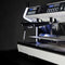 Introducing the Conti MC Ultima Espresso Machine in Black—a modern, sleek appliance featuring dual spouts and LED backlighting. Its design includes rows of buttons and digital displays set against a dark background, emphasizing its shiny metal finish and minimalist aesthetics. Equipped with pre-infusion technology and adjustable temperature settings, it provides a customized brewing experience.