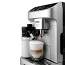 A sleek, modern DeLonghi Magnifica Plus Super Automatic Espresso Machine with LatteCrema System (ECAM32070SB) - PREORDER is preparing a layered coffee beverage with a creamy froth in a glass cup. The machine features a built-in milk frother with a transparent milk container, and the setup is displayed against a white background.