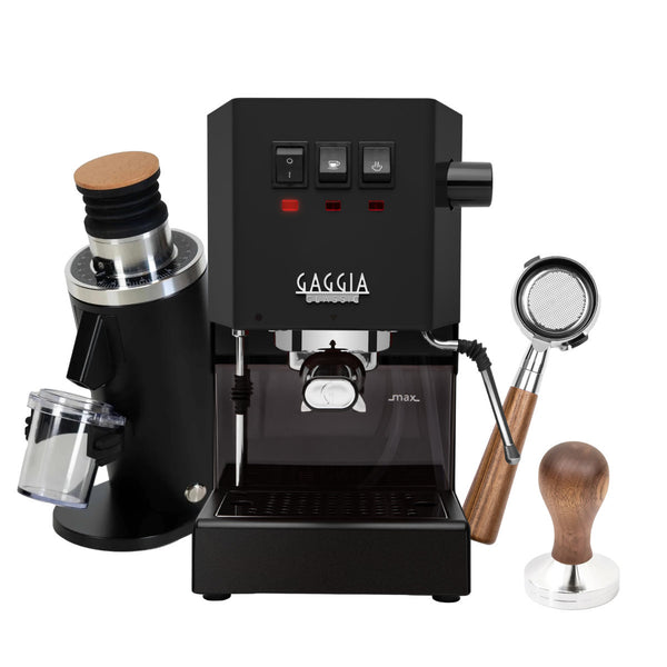 The Gaggia CYBER MONDAY BUNDLE, featuring the Classic E24 Thunder Black espresso machine, is positioned beside the DF54 Grinder in black, along with a bottomless walnut portafilter and walnut tamper. This setup includes control buttons and a steam wand, offering a sleek design that's ideal for home baristas and coffee enthusiasts.