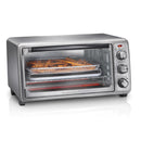 The Hamilton Beach Sure-Crisp Air Fryer Toaster Oven 31413 from Hamilton Beach is a versatile stainless steel countertop appliance with a transparent door that highlights its air frying capabilities. Inside, the top tray is filled with cooked fries. The oven features three control knobs on the right side, with an indicator light positioned above the top knob.