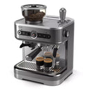 The Philips Barista Brew Semi Automatic Espresso Machine with Dual Bean Hopper PSA3228/01 (Silver) by Philips features a sleek digital control panel and a portafilter dispensing espresso into two small clear cups. The top boasts an aroma seal and built-in grinder filled with coffee beans, while the right side has a steam wand for frothing milk.