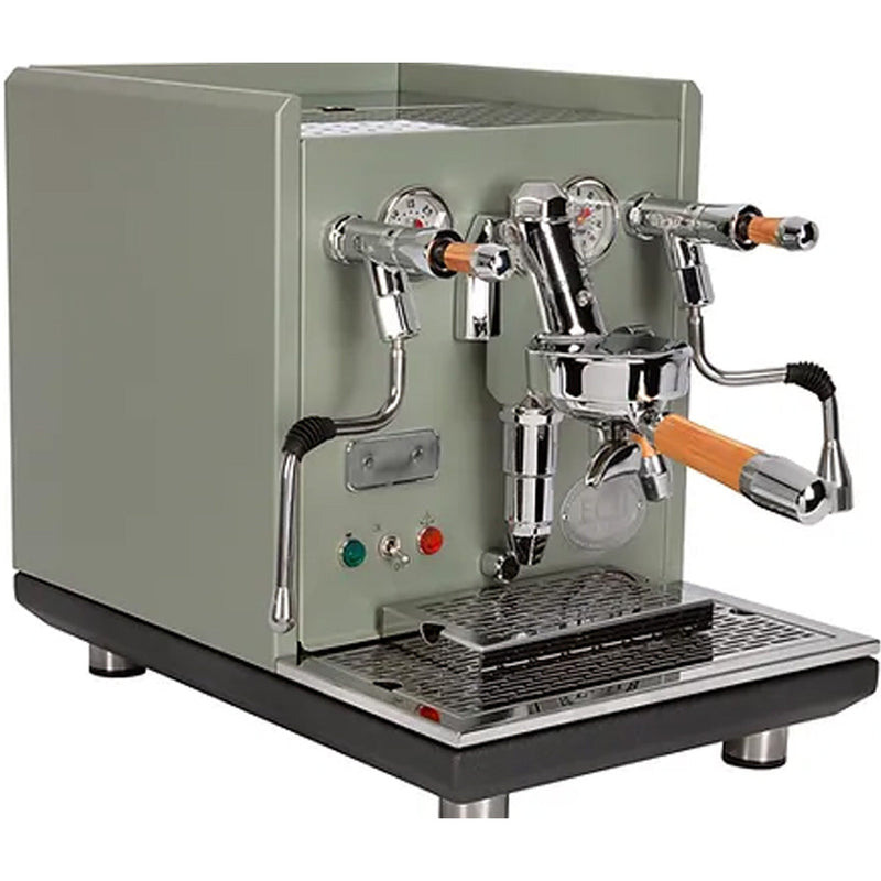 The ECM Synchronika Espresso Machine - Dual Boiler w/ PID and Flow Control (Special Edition Cement Grey) by ECM is a sleek rectangular machine that boasts multiple levers and gauges, featuring a steam wand and an E61 Group Head dual spout portafilter. It also includes green and red indicator lights, a metal drip tray, and elegant wooden handles.