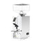 Image of a polished chrome Eureka Oro Mignon Dolce Vita coffee grinder by Eureka with a clear, rectangular bean hopper on top. The front features a digital display and control buttons, positioned above the coffee grounds dispenser. The grinder, equipped with Pure Diamond Burrs and Silent Technology, has a sleek, modern design.