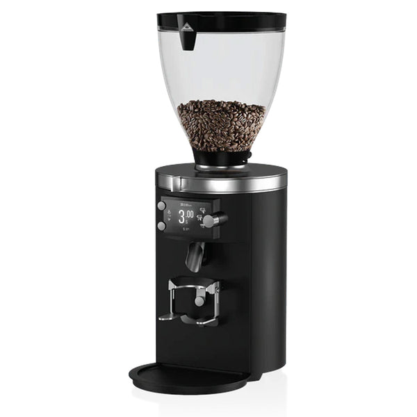 The MAHLKÖNIG E80 Supreme Espresso Grinder in black showcases flat burrs for precise grinding, complemented by a sleek black and silver design. It features a digital display and a transparent bean hopper filled with coffee beans, stylishly set against a white background.