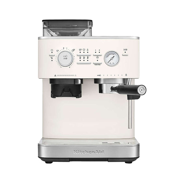 The KitchenAid Semi Automatic Espresso Machine with Burr Grinder KES6551PL in Porcelain comes equipped with a digital display, control knobs, steam wand, and portafilter. It features smart dosing technology with a bean hopper on top and includes a convenient stainless steel drip tray at the bottom.