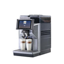 A sleek, modern Saeco Magic M2+ Commercial Coffee Machine with a digital display screen, capable of brewing two customizable beverages. This semi-automatic espresso maker is designed for home or office use and features a coffee bean compartment on top.