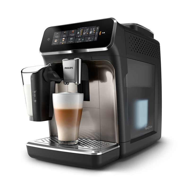 A sleek and modern Philips 3300 LatteGo Super Automatic Espresso, Cappuccino, & Latte Macchiato Machine with SilentBrew EP3347/90 (Black Chrome) dispenses a frothy latte into a glass cup. It features a digital display screen on the top, the innovative LatteGo system for café-quality beverages, and a drip tray below the cup. The machine is black with metallic accents and has a stylish, compact design.